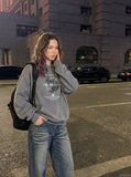 DAXUEN medium wash distressed wide-leg jeans with studs — model photo