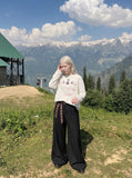 DAXUEN washed black oversized distressed multi-font graphic sweatshirt — model photo