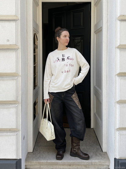 DAXUEN washed black oversized distressed multi-font graphic sweatshirt — model photo