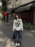 DAXUEN black oversized multi-panel graphic tee — model photo