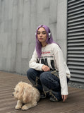 DAXUEN cream oversized newspaper graphic long-sleeve top — model photo