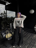 DAXUEN cream oversized newspaper graphic long-sleeve top — model photo