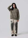 DAXUEN light beige distressed number 10 wide-leg pants — model photo