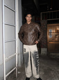 DAXUEN light beige distressed number 10 wide-leg pants — model photo