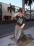 DAXUEN washed dark charcoal grey oversized distressed number graphic hoodie sweatshirt — model photo