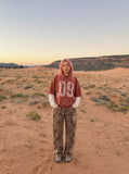 DAXUEN washed dark charcoal grey oversized distressed number graphic hoodie sweatshirt — model photo