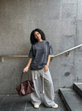 DAXUEN Distressed oversized short-sleeved t-shirt in grey — model photo
