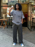 DAXUEN Distressed oversized short-sleeved t-shirt in grey — model photo