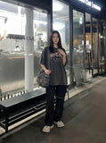 DAXUEN Distressed oversized short-sleeved t-shirt with graphics — model photo