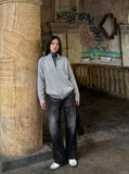 DAXUEN Distressed black wide-leg denim jeans with paint splatters — model photo
