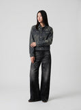 DAXUEN Distressed black wide-leg denim jeans with paint splatters — model photo