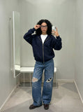 DAXUEN Distressed medium-blue wide leg denim jeans with paint splatters — model photo