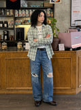 DAXUEN Distressed medium-blue wide leg denim jeans with paint splatters — model photo