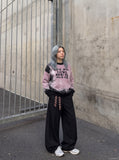 DAXUEN pink oversized splatter graphic sweater — model photo