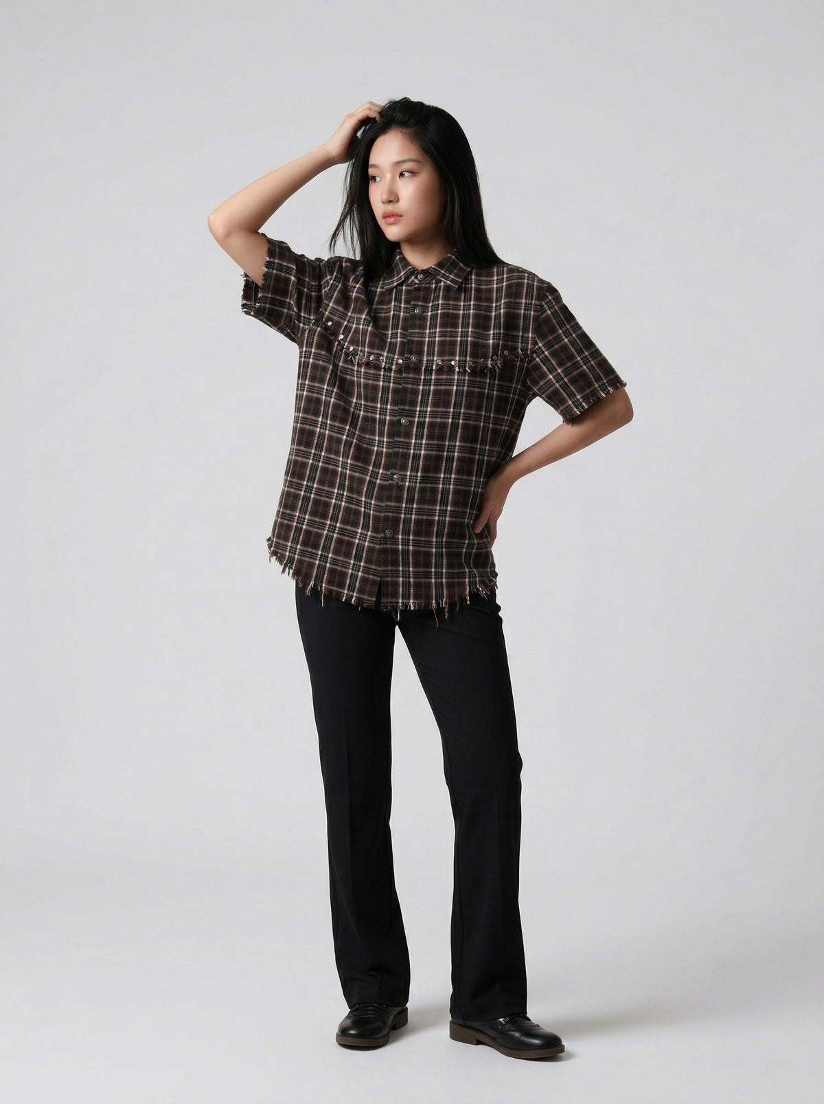 DAXUEN Distressed plaid button-up shirt with frayed edges — model photo