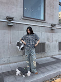 DAXUEN blue and black distressed plaid button-up shirt — model photo