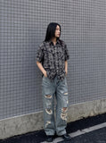DAXUEN blue and black distressed plaid button-up shirt — model photo