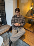 DAXUEN plaid oversized distressed long-sleeve shirt — model photo