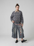 DAXUEN Distressed plaid wide-leg cargo pants — model photo