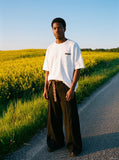 DAXUEN Oversized distressed pocket t-shirt dress — model photo
