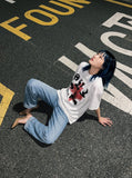 DAXUEN black oversized distressed portrait grid graphic tee — model photo