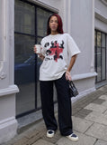 DAXUEN black oversized distressed portrait grid graphic tee — model photo