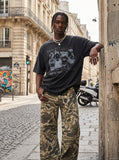 DAXUEN washed black oversized distressed portraits graphic tee — model photo
