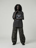DAXUEN washed black oversized distressed portraits graphic tee — model photo