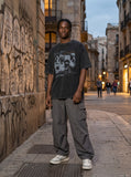 DAXUEN washed black oversized distressed portraits graphic tee — model photo