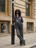 DAXUEN washed black oversized distressed portraits graphic tee — model photo