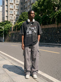 DAXUEN washed black oversized distressed portraits graphic tee — model photo