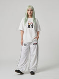 DAXUEN white oversized distressed red graphic tee — model photo