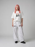 DAXUEN white oversized distressed red graphic tee — model photo