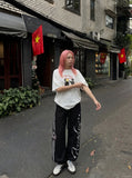 DAXUEN white oversized distressed red graphic tee — model photo