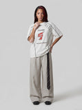 DAXUEN white oversized distressed number 5 graphic tee — model photo