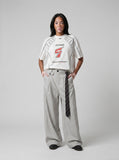 DAXUEN white oversized distressed number 5 graphic tee — model photo