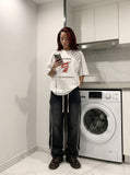 DAXUEN white oversized distressed number 5 graphic tee — model photo