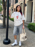DAXUEN white oversized distressed number 5 graphic tee — model photo