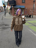 DAXUEN Distressed oversized hooded sweatshirt with rib cage graphic