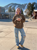 DAXUEN Distressed oversized hooded sweatshirt with rib cage graphic — model photo