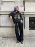 DAXUEN Distressed oversized hooded sweatshirt with rib cage graphic