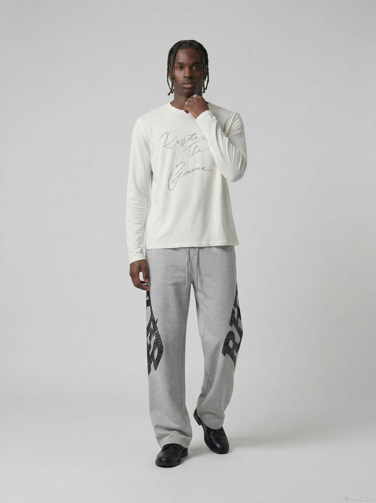 DAXUEN Distressed script long sleeve t-shirt in beige and grey — model photo
