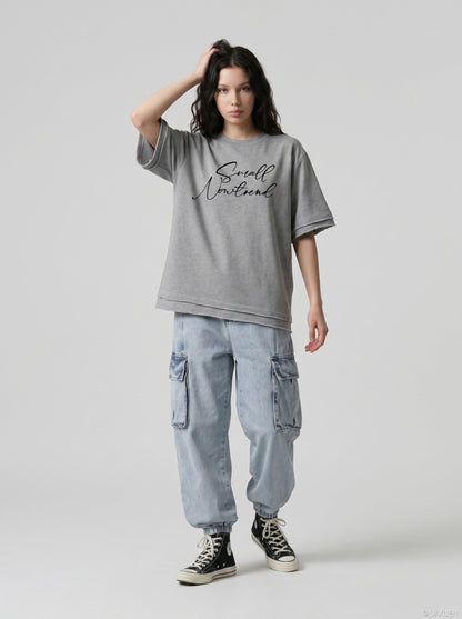 DAXUEN Oversized short-sleeved t-shirt with script print — model photo