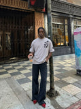 DAXUEN Distressed oversized t-shirt with star graphics — model photo