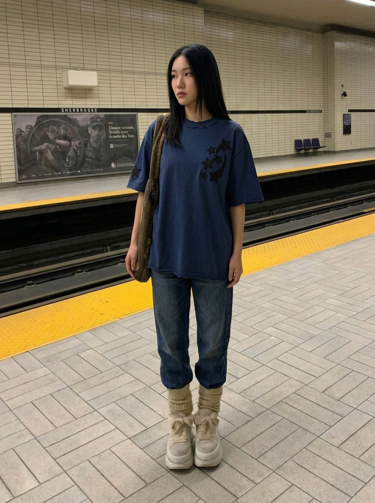 DAXUEN Distressed oversized t-shirt with star graphics — model photo