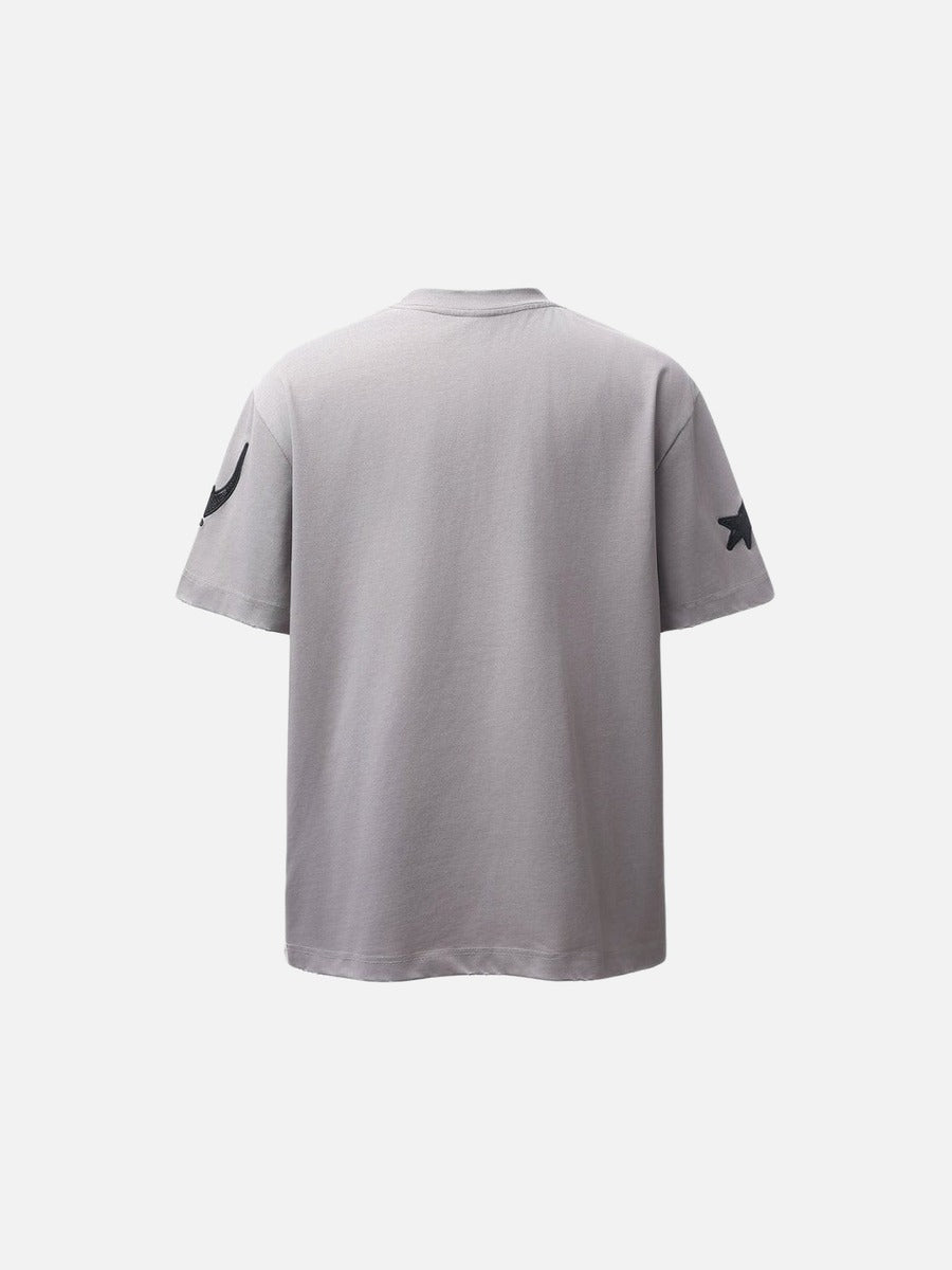 DAXUEN Distressed oversized t-shirt with star graphics