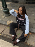 DAXUEN black raglan tee with distressed star graphics — model photo