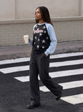 DAXUEN black raglan tee with distressed star graphics — model photo