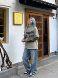 DAXUEN light taupe distressed graphic long sleeve t-shirt — model photo