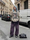 DAXUEN light taupe distressed graphic long sleeve t-shirt — model photo